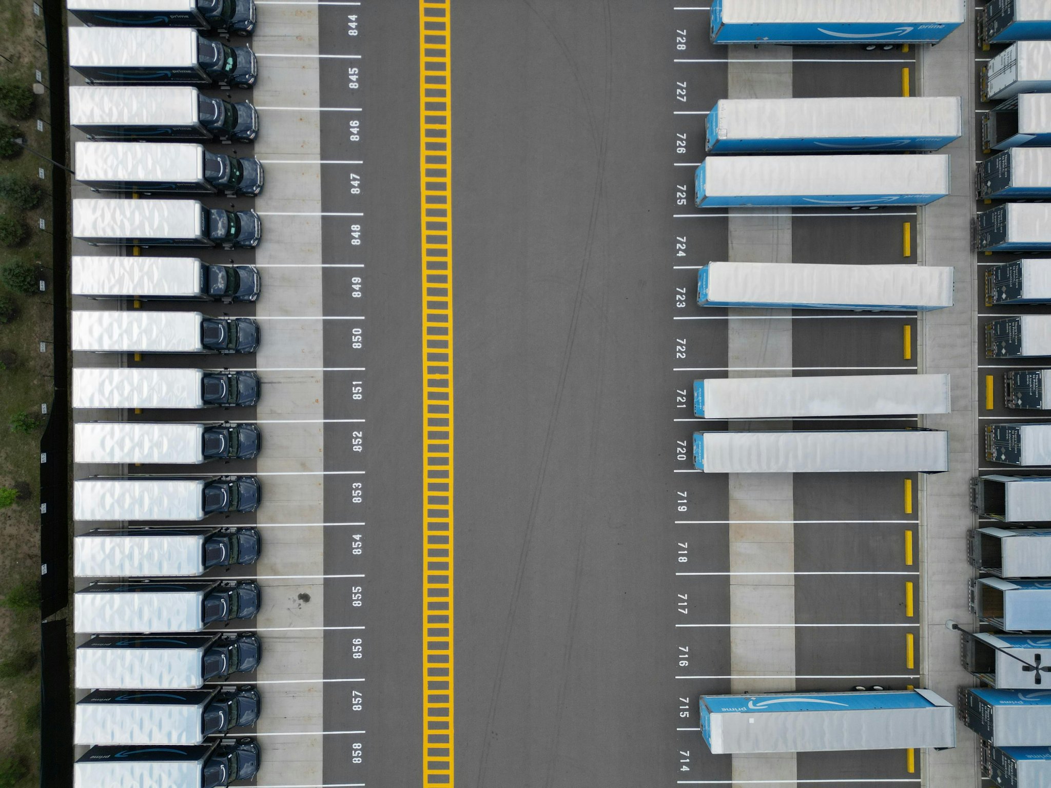 Warehouse aisle with high-bay racking and palletised goods